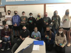 group of students showing severed neckties