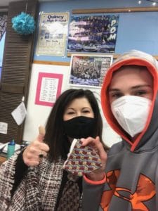 student and teacher holding severed necktie