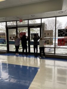 students drawing on the walls